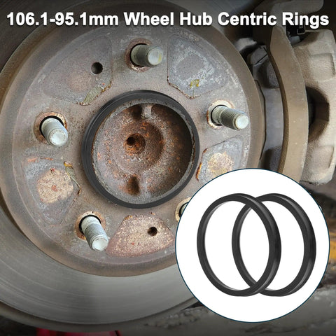 Four Pack Black Polycarbonate Wheel Hub Centric Rings Od 106.1 Mm To Id 95.1 Mm Universal Fit Trucks Svus And Vans Shock Absorbing Center Adapters on a brake assembly close-up.