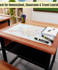 Europe Map 11x17 Laminated Dry Erase Chart on classroom desk with notebook and markers, double-sided with color and blank sides.