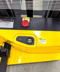 Top view of Heavy Duty Electric Thin Leg Pallet Stacker with yellow control panel, power button, and load chart.
