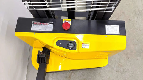 Top view of Heavy Duty Electric Thin Leg Pallet Stacker with yellow control panel, power button, and load chart.