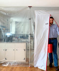 ZipDoor ZDM Magnetic Door Kit in use, self-closing barrier with man exiting, white polyester, 48x87 inches for dust containment.