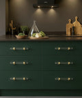 5 Pack Acrylic Cabinet Pulls With Brass Base Crystal Clear Glass Handles In Gold Finish for Modern Kitchens on green drawers