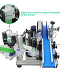 Detail of the automatic round bottle labeling machine featuring adjustment screws and smooth conveyor for 15 to 39 inch bottles.