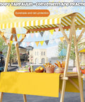 Collapsible Wooden Vendor Cart With Canopy Hella Spacious Market Stall Rack For Street Food and Outdoor Events Built Tough with yellow table.
