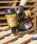 Coil Siding Nailer Workhorse For Wood Projects, shown on a wooden pallet, 1/4 NPT connector, lightweight aluminum housing