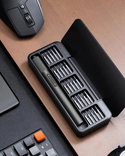 Dope 25 In 1 Mini Electric Screwdriver Set With USB C Rechargeable Power on a desk, compact tool for electronics repair.