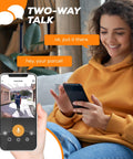 Woman using smartphone with Wireless Video Doorbell Camera With Chime And 2 Way Audio, showing delivery on screen.