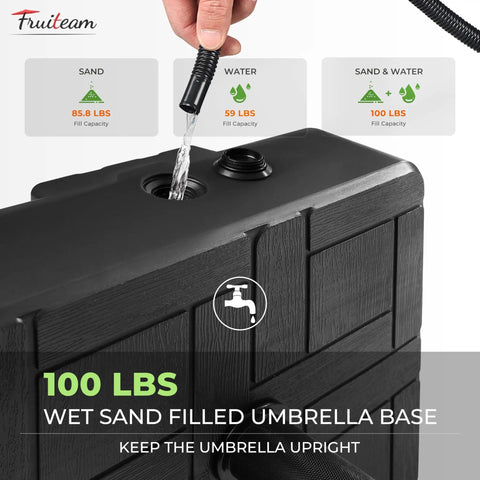 Beefy 100 Lb Fillable Umbrella Base With 4 Wheels And Dual Locks for Easy Move Rust Resistant And Windproof Stand in black being filled with water.
