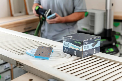 Granat Profile Soft Sanding Sheets 80 By 133 Millimeter, 10 Pack, displayed with box on workbench