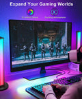 Lit RGB LED Smart Light Bars for TV and PC backlighting setup next to a gaming monitor showing soldiers on screen.