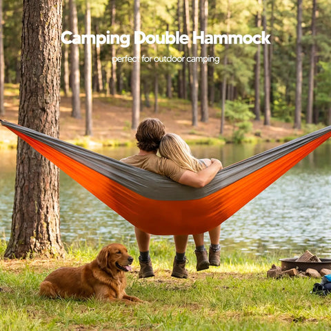 Ultralight Camping Hammock For Hiking And Travel, Durable Outdoor Hammock In Orange, two people relaxing by a lake