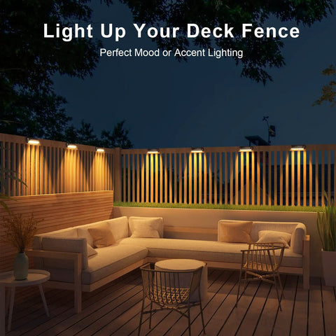 Solar Fence Lights Outdoor Waterproof 4 Pack With Warm White And RGB Color Changing Modes illuminating deck area.