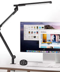 Clamp On Desk Lamp With Eye Care, Swing Arm And Stepless Dimming, Adjustable Color Temperature 3000K To 5500K, next to a computer monitor.