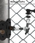 Heavy Duty Magnetic Fence Mount For Action Cameras And Phones With Dual Quarter Inch Mount Points Built For Game Day Recording On Baseball And Tennis Fields Quick Setup For Mevo Start GoPro iPhone And Other Cameras attached to a chain link fence.