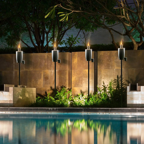 Stainless Steel Outdoor Torches Set Of 2 5 Ft Citronella Oil Lamps with Fiberglass Wick and Snuffer Cap around poolside