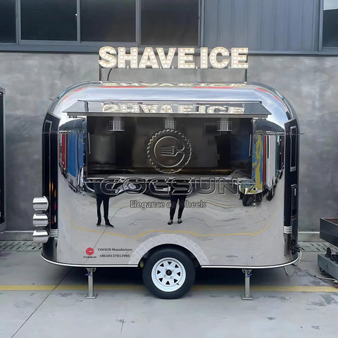 Built Different Stainless Steel Food Truck With Fully Loaded Commercial Kitchen Sleek Custom Mobile Concession Trailer, shiny exterior with SHAVE ICE sign.