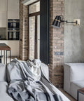 Dope Modern Industrial Swing Arm Wall Sconce In Matte Black With Brass Accents Plug In Or Hardwire in living room