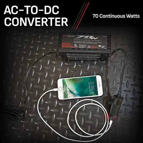 AC To DC Power Converter PC6 70W Continuous 140W Peak 12V DC Accessory Port connected to smartphone on textured surface