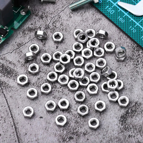 Top Shelf 50 Pack Stainless Steel Hex Nuts With Coarse Thread Built Tough Hardware Fasteners Precision Metal Nut Kit on a work surface.
