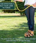 Person wearing Heavy Duty Lawn Aerator Shoes With Metal Buckles For Deep Soil Aeration, 13 Spikes Per Shoe on grass