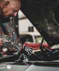 Mechanic wearing Bone Series Foam Nitrile Mechanic Gloves with Grip for Auto Shop Jobs and Everyday Tough Work, working on car engine