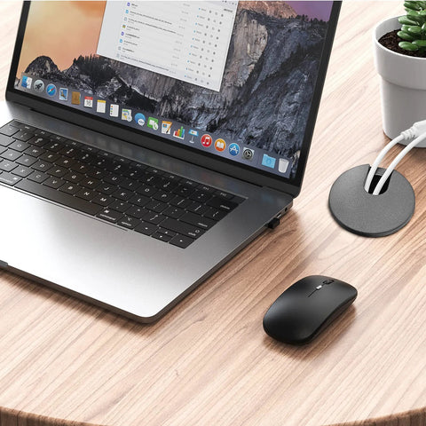 Laptop setup with Black Desk Cable Grommets 1.5 Inch Plastic Hole Covers for organizing cables, showing tidy desk environment.