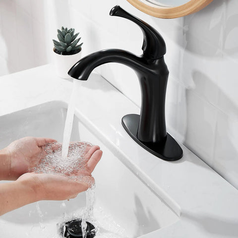 Single Handle Vanity Faucet For Bathroom Sink With Pop Up Drain 1 Or 3 Hole Installation Matte Black Finish in use over sink