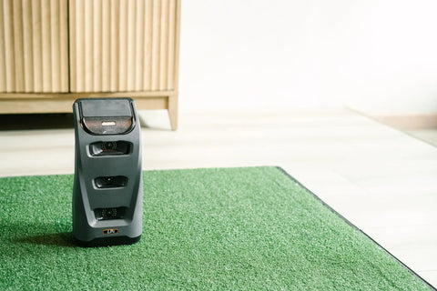 Launch Pro I Circle B Edition Golf Bundle With Net Return Bay 10 10 Ft Simulator Bay on putting green mat in room