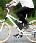 Cyclist on bike with Colorful Bike Spoke Beads Kit 144 Pcs Of Glow In The Dark Spoke Lights And Clips Easy Install Decorations
