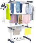Top Shelf Oversized Four Tier Clothes Drying Rack With A Built Tough Foldable Frame Plus Side Wings For Hanging Laundry Towels Shoes And Quilts Roomy Air Drying Setup with clothes and towels drying.