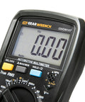 Close-up of Automotive Pro Grade Digital Multimeter With True RMS, displaying 0.00 Hz on screen, buttons and dial visible.
