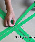 Person applying green painter tape at brick joint, showcasing Green Painter Tape For Car Paint Jobs And Home Projects No Residue Automotive Masking