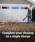 Person using Nitro Cordless Leaf Blower With 410 CFM Airflow And 130 MPH Turbo Power, Ultra Lightweight at 3.8 lbs, WG543 on driveway