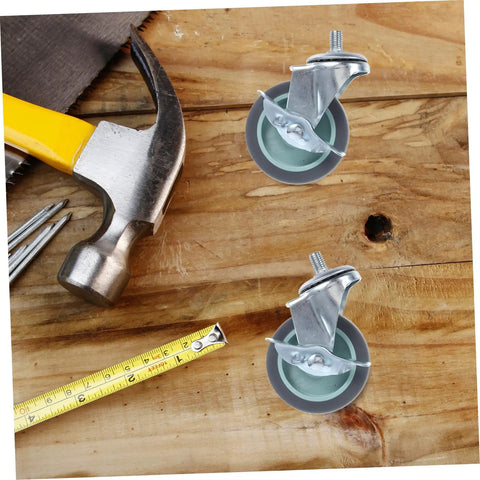 Hella Durable Smooth Operator Four Piece Heavy Duty Swivel Caster Wheels With Threaded Stem Attachment And Secure Lockable Brakes on wood surface with tools.