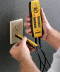 Person using Voltage And Continuity Tester With Non Contact AC Detection 50 600V AC Range DC Polarity Indication in outlet