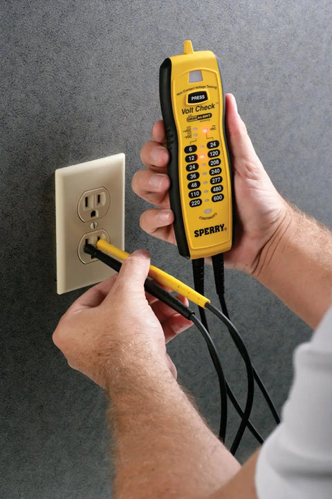 Person using Voltage And Continuity Tester With Non Contact AC Detection 50 600V AC Range DC Polarity Indication in outlet