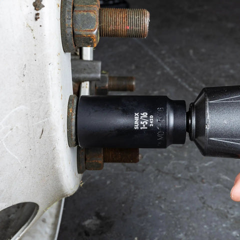 Using Forty Three Piece One Half Inch Drive Impact Socket Set Built Tough With Chromoly Steel Construction on heavy-duty bolt