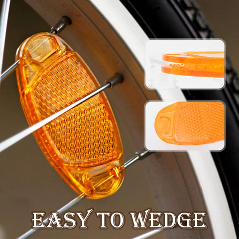 Close-up of orange wheel spoke reflector from Six Pack Bike Reflectors Front And Rear With Wheel Spoke Brackets Easy to Wedge.