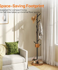 Coat Rack With Nine Hooks Freestanding Metal Hall Tree With Wooden Base For Entryway Space Saving Coat Hanger Stand Heavy Duty Rustic Brown Finish With Thickened Base in a living room next to a sofa.