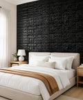 Sleek Black 3D Wall Panels Peel And Stick Foam Brick Wallpaper Tiles self-adhesive design showcased in a modern bedroom setting.