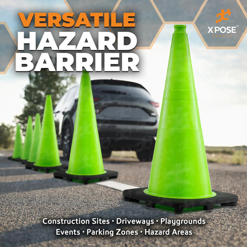 28 Inch Lime Green Traffic Cone 6 Pack Heavy Duty PVC Safety Cone For Parking Lots Construction Zones Road Crews And Emergency Vehicles DOT Approved in line on asphalt with a backdrop of a car in the distance.