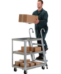 Top Shelf Aluminum Stock Picker Cart With Built In Steel Step Ladder 1000 Lb Max Payload Rating Double Shelf Rolling Platform used to lift boxes.