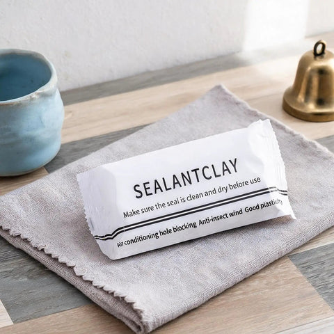 Sealant clay packaging on a cloth in a home setting, used for DIY sealing putty for wall holes and cracks waterproof duct mastic sealant paste.