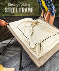 Queen Size Airbed Cot With Folding Steel Frame And Side Table Battery Pump Included Portable Camping Bed being set up outdoors.