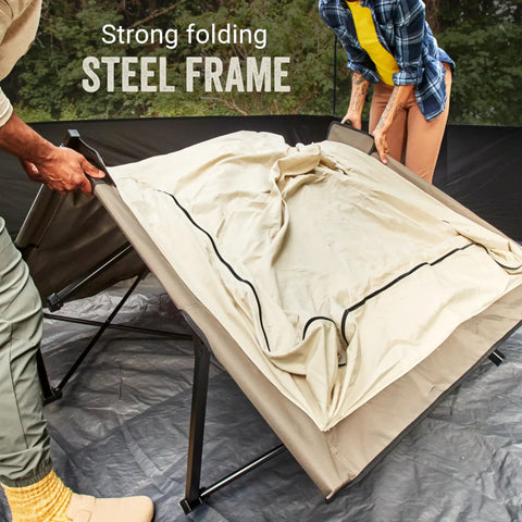 Queen Size Airbed Cot With Folding Steel Frame And Side Table Battery Pump Included Portable Camping Bed being set up outdoors.