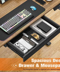 Electric Standing Computer Desk With RGB Lighting And Drawers For Home Office Gaming Setup showing spacious drawer with organization.