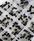 Close-up view of an All Purpose Transistor Assortment Kit With 400 Pieces, 20 Popular PNP NPN Bipolar and Power Transistors in box compartments