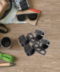 Ten Pack Large Plastic Camping Tent Hooks Sturdy Hanging Organizer Hooks for Tent Poles and Outdoor Gear on wooden surface
