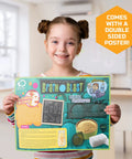 Smiling child holding a Brain Blast educational poster in a classroom.