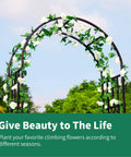 Sturdy Black Wrought Iron Pergola Arbor Garden Arch With Ground Spikes 100 Inches High And 45 Inches Wide Outdoor Climbing Plants Trellis For Weddings Parties And Patio Decor with white flowers climbing.